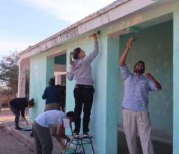 Volunteers painting the rural school