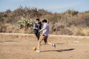 Children playing soccer at school