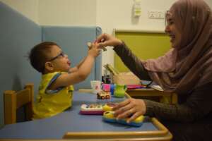 "A child enjoying his speech therapy session"