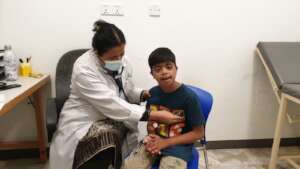 "A child during his checkup at the cardiac camp"