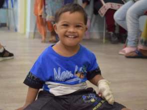 A child enjoying and beaming with joy at KDSP