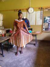 One of the women showing off her dress she made!