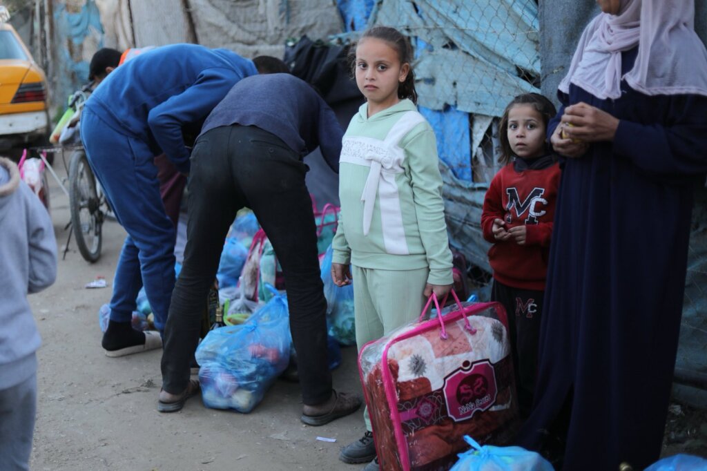 A PKU patient receiving a blanket and parcel