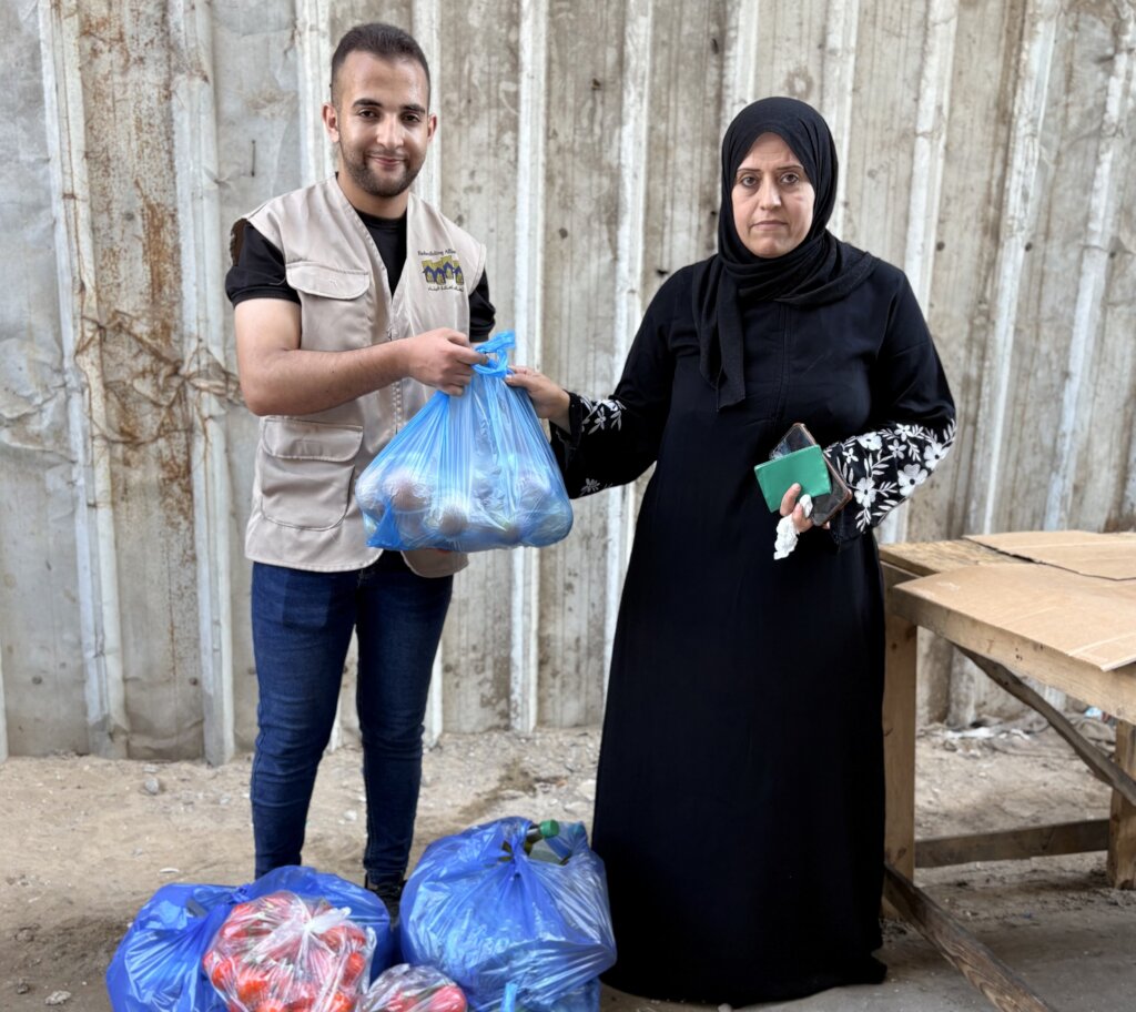 Ali and Alia's mother receiving a parcel