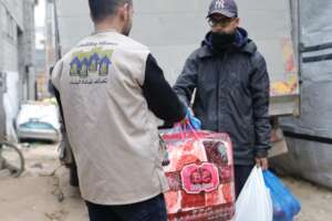 Hassan's brother receiving a parcel on his behalf