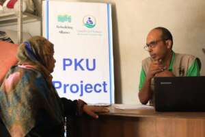 Dr Muhammad speaking to a PKU parent