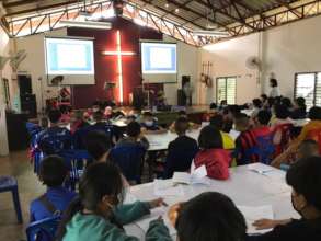 Youth learning how to make a household accounting