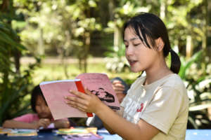 Children practice presenting with confidence