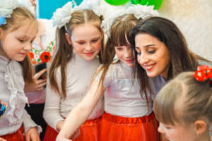 Lala (Right) plays with children in Popasna