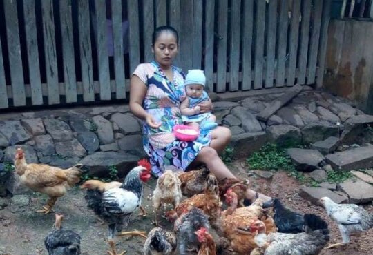 Maria, her baby, and her hens