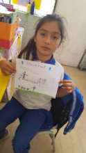 Girl showing her drawing on family experience