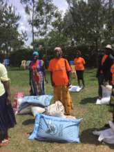 Widows receiving farm inputs
