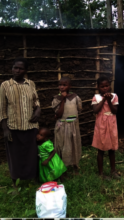 a family in the village recieving a food basket