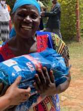 Last year's distribution, a widow receiving seeds