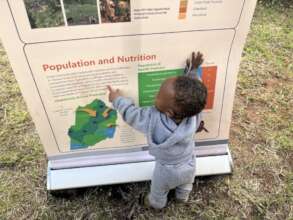 Toddler and poster at ASHR Gathering