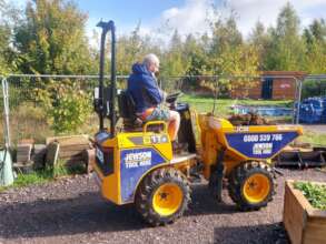Paul learns to drive the dump truck
