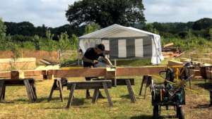 Logs hewn and milled, framing can start