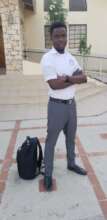One of the Deaf adults in his school uniform