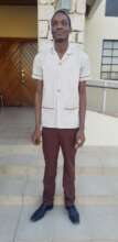 One of the blind adults in his school uniform