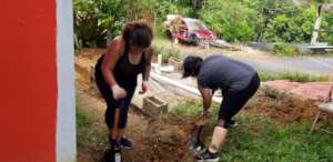 Volunteers digging for water irrigation