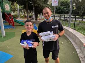 Uriah and his trainer with their new Nike shoes