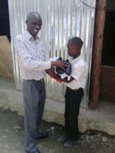 Presenting donated set of uniforms