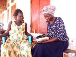 A staff taking data and information on her work