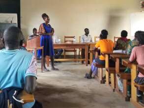 A former trainee speaks during the session