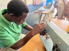 Ajoki setting a sewing machine in the Dress Design