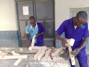 Carpentry learners working on portable tables