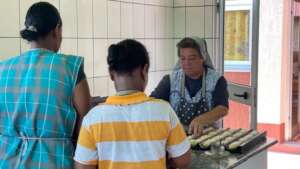 Our local representative distributing food