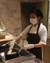 Desy preparing the food during her training