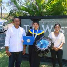 Tasya and her parents after the graduation
