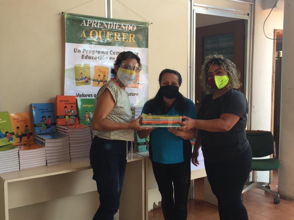 Suyin delivering books to Prof. Carla Blanco