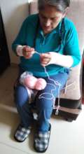 Maria knitting, part of her hand therapy