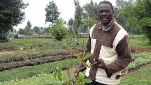 Trees for Kenya founder with seedlings