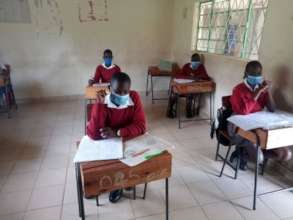 girls sitting exams