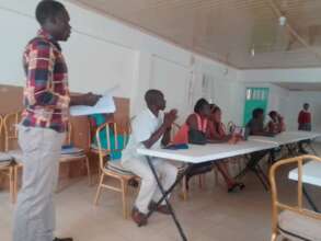 Teachers meeting with parents to discuss progress