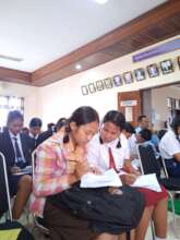 Student reading their booklet