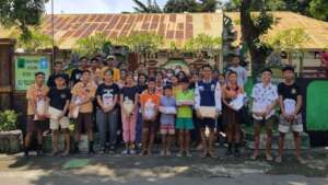 Students take picture together with the supplies