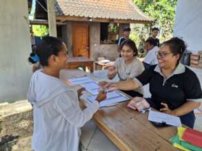 Parent receiving the allowance in Karangasem