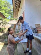 Handing over the package to mother