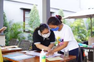 YKIP staff and volunteer preparing for the event