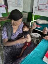 A mother and her baby, supported by PHASE Nepal