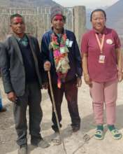Janak (middle) in good health after treatment