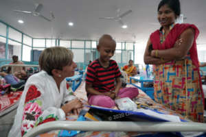 TWCC volunteer physican speaking to child & mother