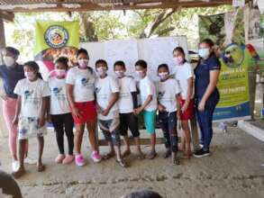 Children sporting their new macaw shirts