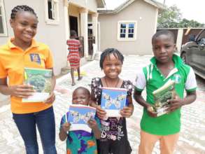 Excited beneficiaries with their writing materials