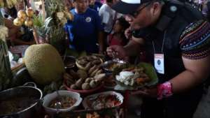 A delegate enjoying the lunch with the community