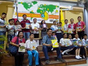 Posing for the camera, showing off their new books